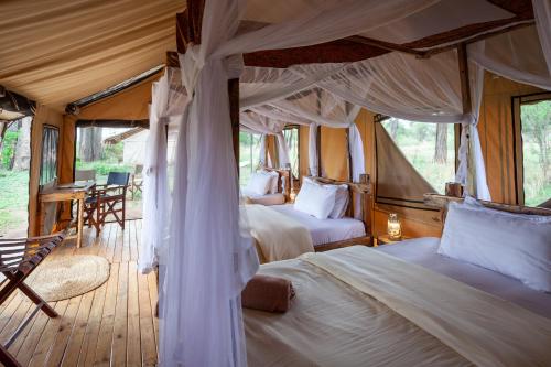 Postel nebo postele na pokoji v ubytování Mawe Tented Camp