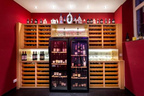 
a store with many bottles of wine on display at Drei Loewen in Munich
