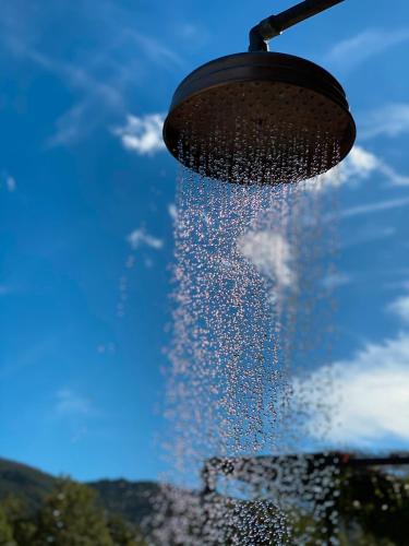 a droplet of water is pouring out of a pot at Chambres d'hote Bergerie A Maredda in Murato