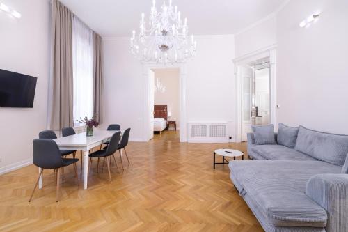 a living room with a couch and a table at City Hotel Matyas in Budapest