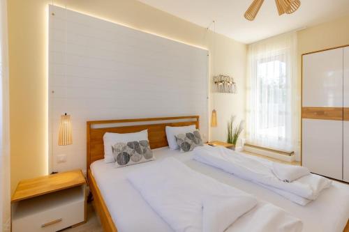 Postel nebo postele na pokoji v ubytování Balaton Breeze Pihenőház by BLTN