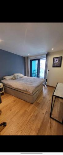 a bedroom with a bed and a large window at 3 bed Ocean Spa Plaza Luxurious flat in Gibraltar