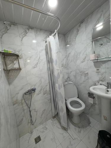 a bathroom with a toilet and a sink at Sun House in Yeghegnadzor