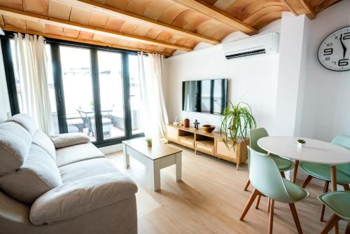 a living room with a couch and a table at House in the Old Town of Marbella with Private Pool and Free Parking in Marbella