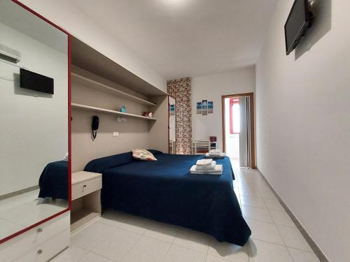 Postel nebo postele na pokoji v ubytování Hotel Villa Susy