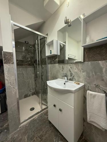 a bathroom with a sink and a shower at Mare & Laguna in Chioggia