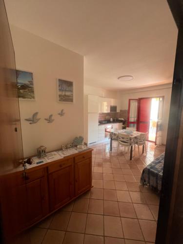 a kitchen with a sink and a table at La Casa di Lore & Leo in Alghero
