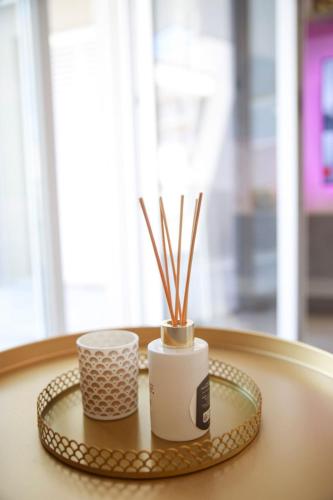 two cups on a tray on a table at Celsius Home in Lecce