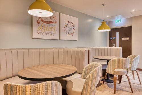 a waiting room with two tables and chairs at Premier Inn Dublin City Temple Bar in Dublin