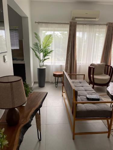 a living room with a couch and a table at Lovely Serene Apartment with 24hrs Power in Ikate
