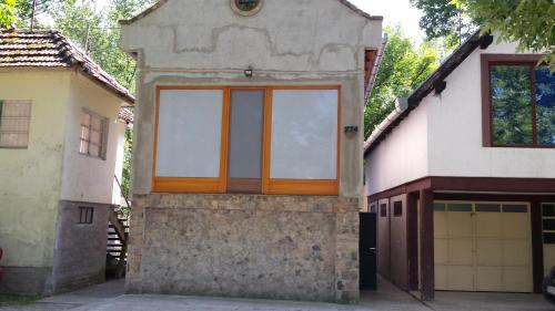 a large window on the side of a house at Holiday Home Baracka in Bezdan
