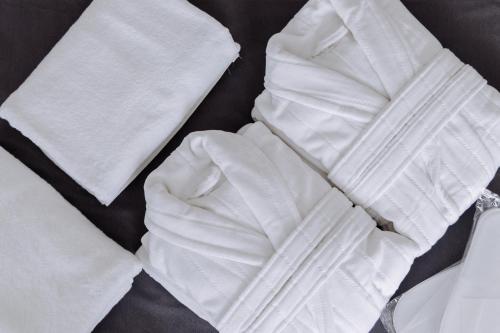 a pile of white napkins on a table at TÖR by Uly Dala Hotels in Kostanay
