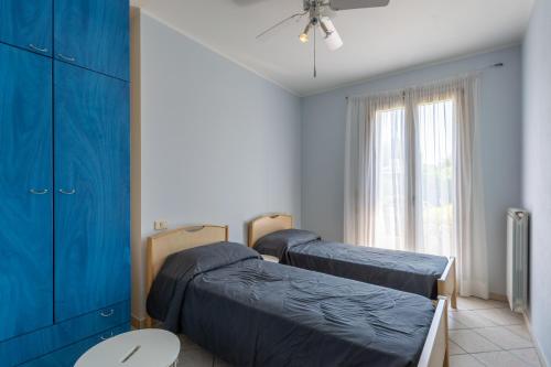 a hospital room with two beds and a window at Isola di Albarella in Isola Albarella
