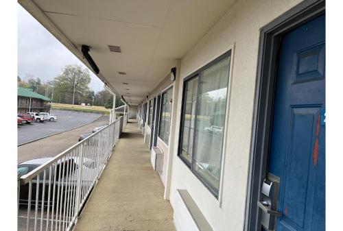 a corridor of a building with a blue door at Motel 6 Millington TN in Millington