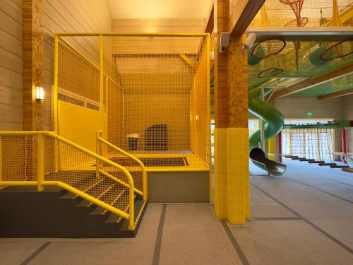 a playground with a slide in a building at Hot Springs Medical and SPA in Banya