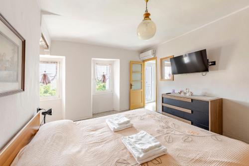 Una cama o camas en una habitación de La terrazza del nonno
