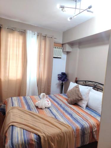 Katil atau katil-katil dalam bilik di Condominium in Davao city