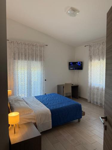 a bedroom with a bed and a television in it at B&B Arco Dei Sogni in Celano