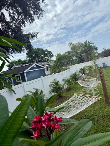 a hammock in a yard next to a fence at Coastal Oasis 64th in Bradenton