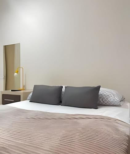 Ένα ή περισσότερα κρεβάτια σε δωμάτιο στο Estadias longa e tranquila - UEM