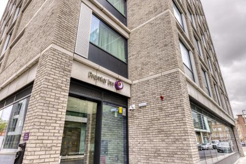 a brick building with a sign on the side of it at Premier Inn Dublin City Gloucester St South in Dublin