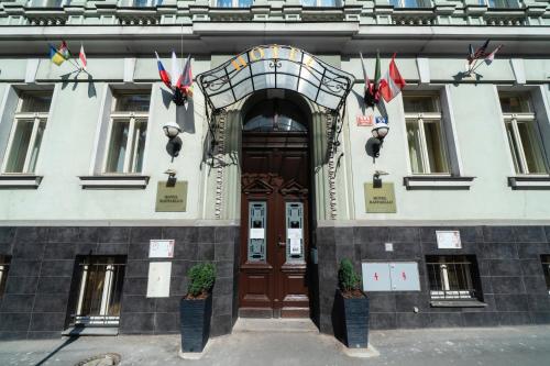 an entrance to a building with a wooden door at Hotel Raffaello Prague in Prague