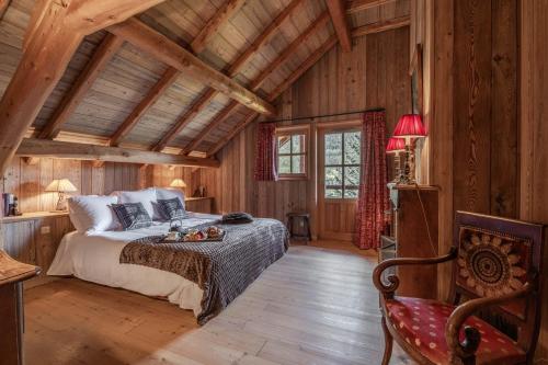 Ένα ή περισσότερα κρεβάτια σε δωμάτιο στο Le Chalet l'Harmonie - Pierres d'Histoire