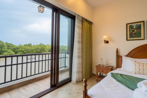 a bedroom with a bed and a balcony at Villa Fleuve 6-BHK Riverfront Hideaway With Infinity Pool & Bathtub in Nerul