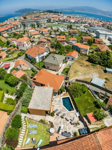 an aerial view of a residential neighborhood with a house at CABAÑA VILA DO MAR in Baiona