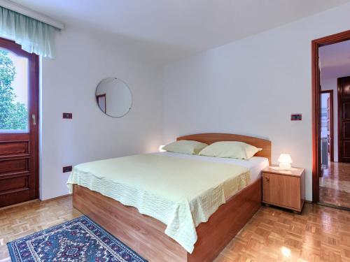 Ένα ή περισσότερα κρεβάτια σε δωμάτιο στο Apartment Lorenzin by Interhome