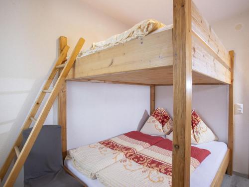 Postel nebo postele na pokoji v ubytování Apartment Ferienhof Sonnseitn-2 by Interhome