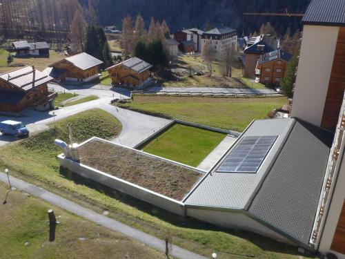 a house with a solar panel on the side of it at Studio Les Erables Apt 361 by Interhome in Zinal