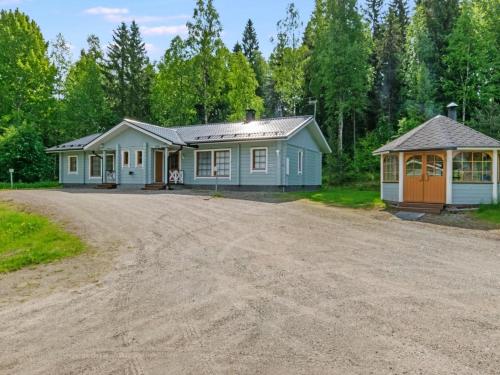 a house with a dirt road in front of it at Holiday Home Kurre by Interhome in Lahdenperä