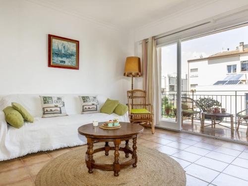 a living room with a couch and a table at Apartment Albaniz by Interhome in Tossa de Mar
