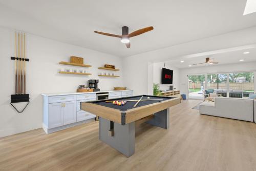a living room with a pool table in it at 18 Guests Pool Pickleball Volleyball in Seminole