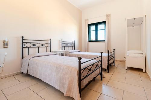 Katil atau katil-katil dalam bilik di Masseria San Biagio