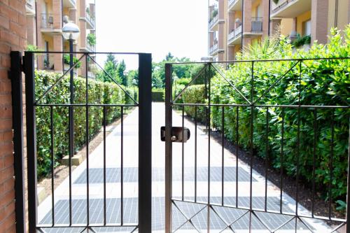 a gate to a walkway in a building at Daste Dream House in Bergamo