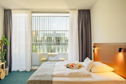 Giường trong phòng chung tại Nomad Design & Lifestyle Hotel