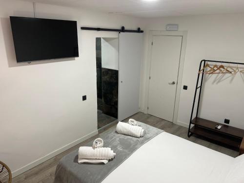 Letto o letti in una camera di Hostal Las Cruceras