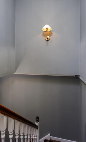 a light on the top of a stair case at Munro Guest House in Stirling
