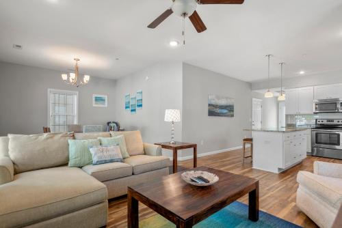 a living room with a couch and a table at The E Gull Has Landed in Kill Devil Hills