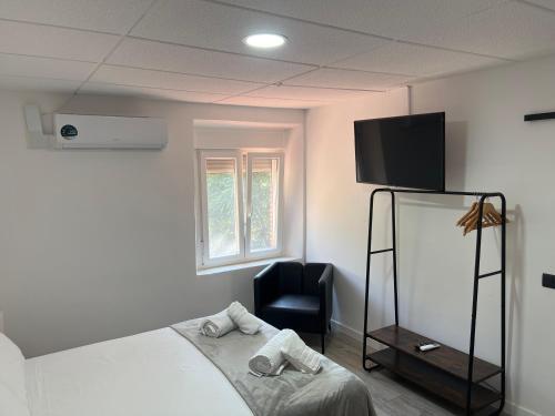 Letto o letti in una camera di Hostal Las Cruceras