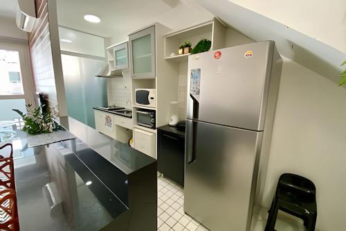 Kuchyň nebo kuchyňský kout v ubytování Conforto e estilo contemporâneo no Gonzaga