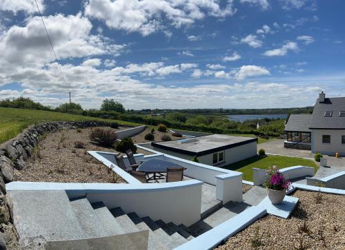 an aerial view of a house with a stone wall at Lake View Doubleroom&private Bath in Castlebar