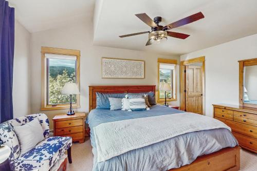 a bedroom with a bed and a ceiling fan at Moose Crossing at Town Center in Big Sky