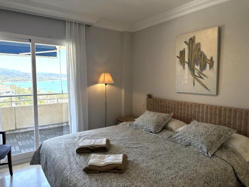 A bed or beds in a room at TopMarbella Marina Banus luxurious apartment, Sea and mountain views