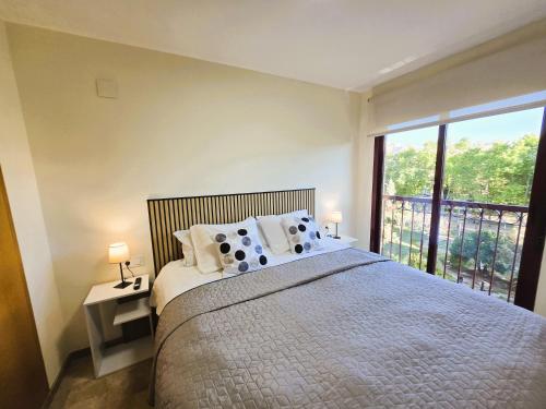 En eller flere senge i et værelse på Enjoy Gandia