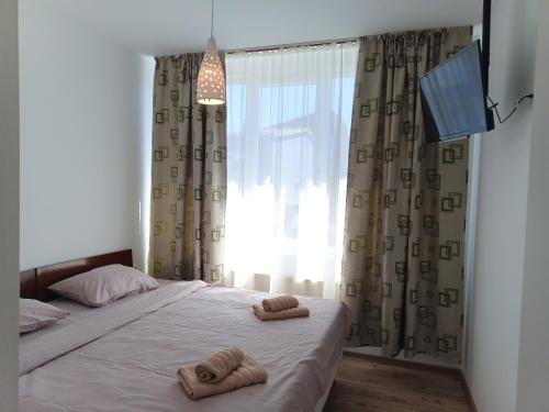 Ένα ή περισσότερα κρεβάτια σε δωμάτιο στο Bliss Point Apartments