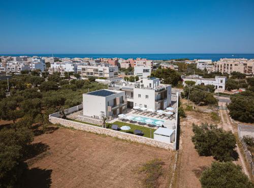 an aerial view of a house with a swimming pool at Eleia Domos in Monopoli