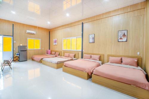 Cama o camas de una habitación en Nirvana Beach Villages